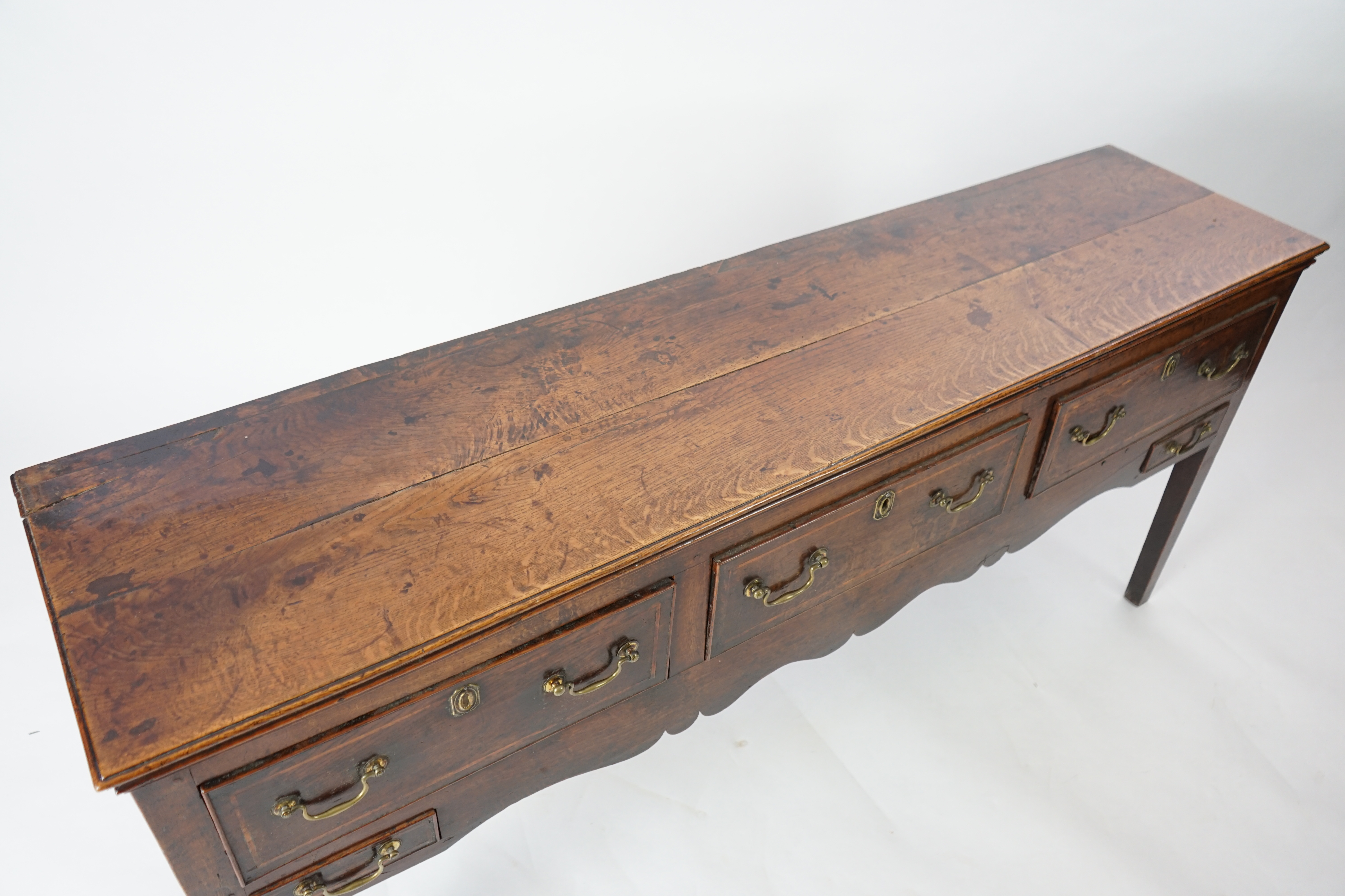 A mid 18th century oak dresser base